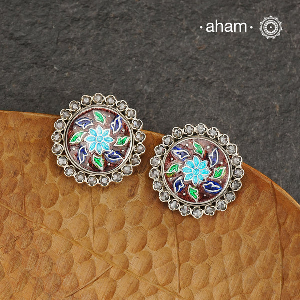 Elevate your style with our Meena Work Silver Earrings. Handcrafted in 92.5 silver, these earrings feature traditional meenawork, adding intricate detail to your ensemble. Enhance your look with this elegant and timeless accessory.