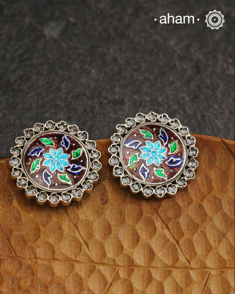 Elevate your style with our Meena Work Silver Earrings. Handcrafted in 92.5 silver, these earrings feature traditional meenawork, adding intricate detail to your ensemble. Enhance your look with this elegant and timeless accessory.