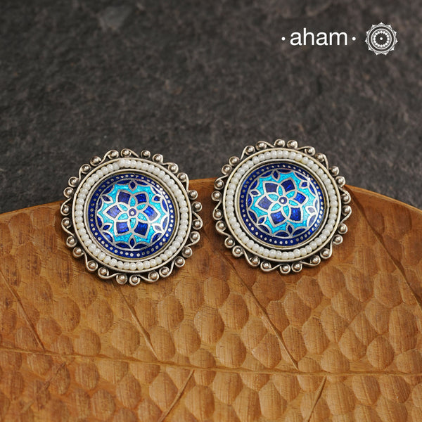 Elevate your style with our Meena Work Silver Earrings. Handcrafted in 92.5 silver, these earrings feature traditional meenawork, adding intricate detail to your ensemble. Enhance your look with this elegant and timeless accessory.