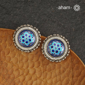 Elevate your style with our Meena Work Silver Earrings. Handcrafted in 92.5 silver, these earrings feature traditional meenawork, adding intricate detail to your ensemble. Enhance your look with this elegant and timeless accessory.