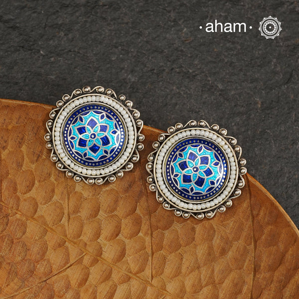 Elevate your style with our Meena Work Silver Earrings. Handcrafted in 92.5 silver, these earrings feature traditional meenawork, adding intricate detail to your ensemble. Enhance your look with this elegant and timeless accessory.