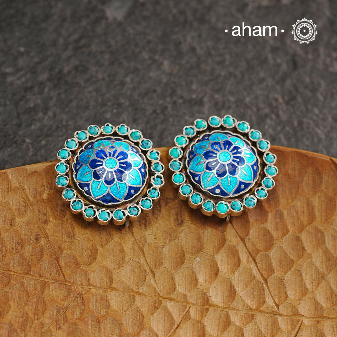Elevate your style with our Meena Work Silver Earrings. Handcrafted in 92.5 silver, these earrings feature traditional meenawork, adding intricate detail to your ensemble. Enhance your look with this elegant and timeless accessory