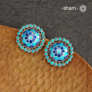 Elevate your style with our Meena Work Silver Earrings. Handcrafted in 92.5 silver, these earrings feature traditional meenawork, adding intricate detail to your ensemble. Enhance your look with this elegant and timeless accessory.