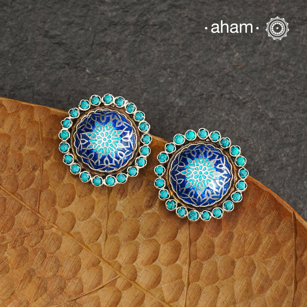 Elevate your style with our Meena Work Silver Earrings. Handcrafted in 92.5 silver, these earrings feature traditional meenawork, adding intricate detail to your ensemble. Enhance your look with this elegant and timeless accessory.