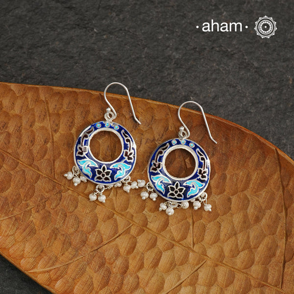 Elevate your style with our Meena Work Silver Earrings. Handcrafted in 92.5 silver, these earrings feature traditional meenawork, adding intricate detail to your ensemble. Enhance your look with this elegant and timeless accessory.
