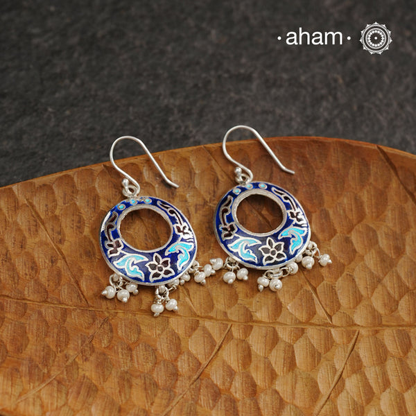 Elevate your style with our Meena Work Silver Earrings. Handcrafted in 92.5 silver, these earrings feature traditional meenawork, adding intricate detail to your ensemble. Enhance your look with this elegant and timeless accessory.