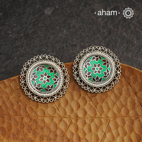 Elevate your style with our Meena Work Silver Earrings. Handcrafted in 92.5 silver, these earrings feature traditional meenawork, adding intricate detail to your ensemble. Enhance your look with this elegant and timeless accessory.