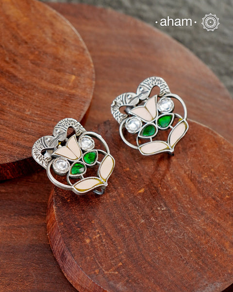 Beautiful Ira stud earrings with kundan work. Handcrafted in 92.5 sterling silver with double fish motifs. Can be paired with both ethnic and western outfits.