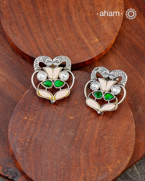 Beautiful Ira stud earrings with kundan work. Handcrafted in 92.5 sterling silver with double fish motifs. Can be paired with both ethnic and western outfits.