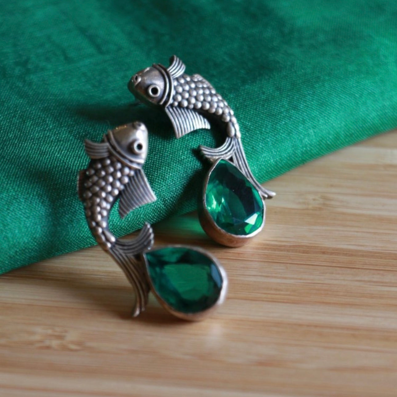 Beautiful Ira fish motif earrings. Handcrafted in 92.5 sterling silver with semi precious stone drop. Works great with smart casuals and workwear. 
