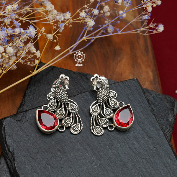 Handcrafted 92.5 sterling silver Ira earrings. Intricate peacock motif with a beautiful red drop. Perfect as casual and work wear. 