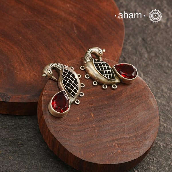 Handcrafted 92.5 sterling silver Ira earrings. Intricate peacock motif with a beautiful red drop. Perfect as casual and work wear.