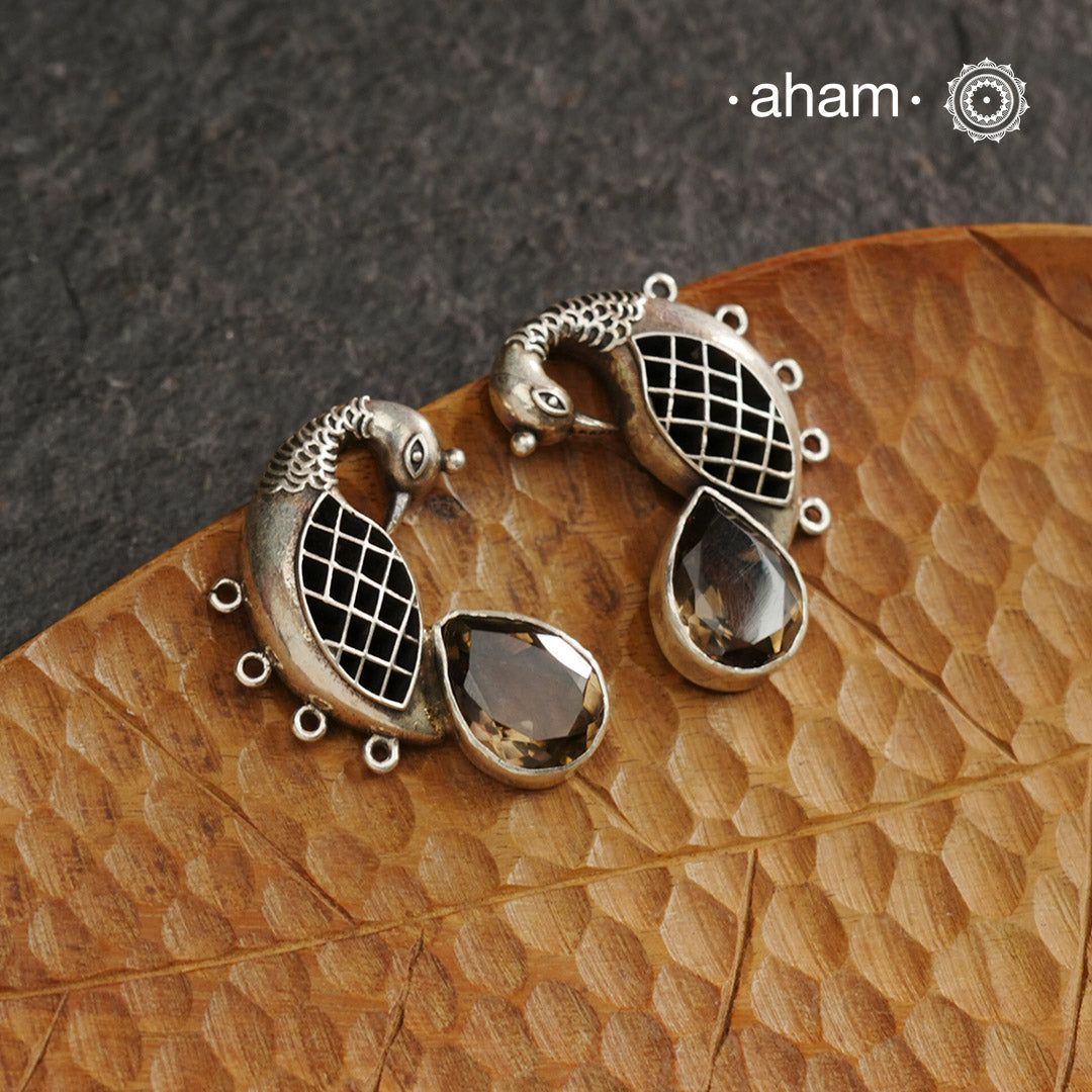 Handcrafted 92.5 sterling silver Ira earrings. Intricate peacock motif with a beautiful red brown stone drop. Perfect as casual and work wear.