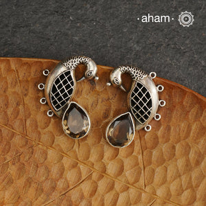 Handcrafted 92.5 sterling silver Ira earrings. Intricate peacock motif with a beautiful red brown stone drop. Perfect as casual and work wear.