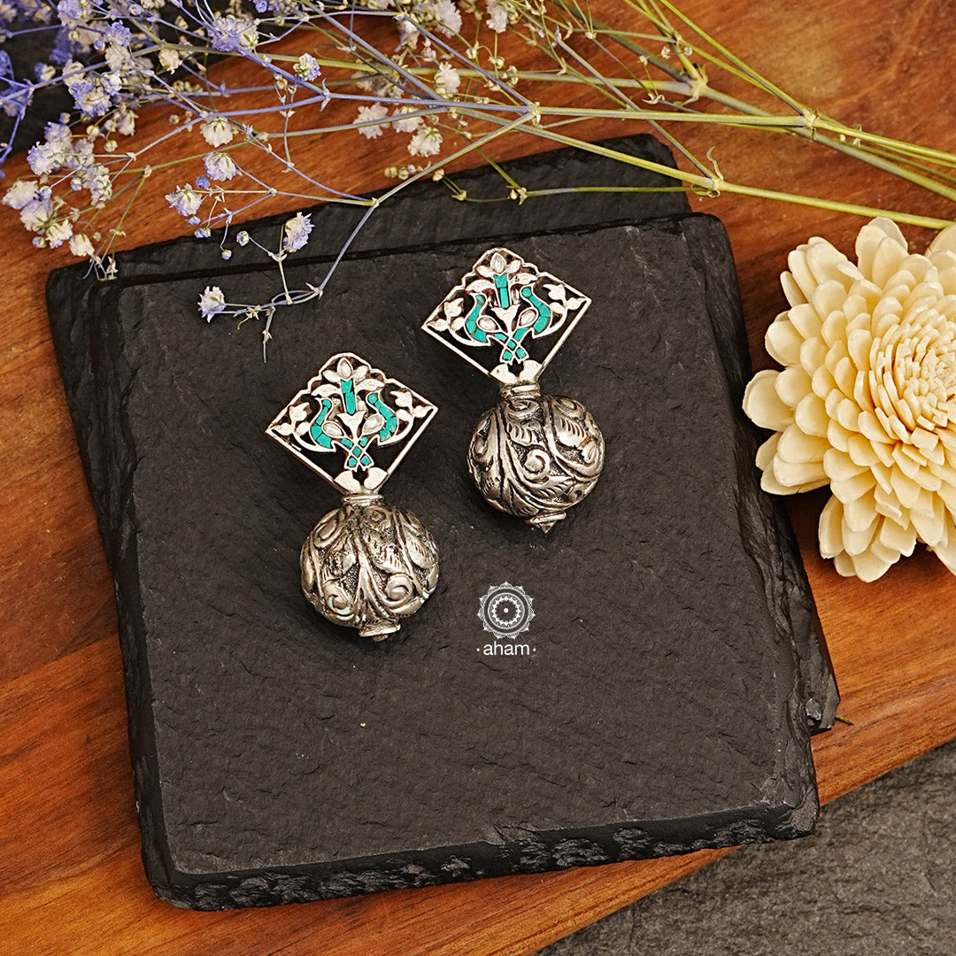 Elevate your look with these stunning Ira Drop Silver Earrings! Crafted in 92.5 silver, with mesmerising Kundan top and chital ball drop are sure to turn heads. Perfect for any occasion, add a touch of glamour to both your ethnic and western outfits