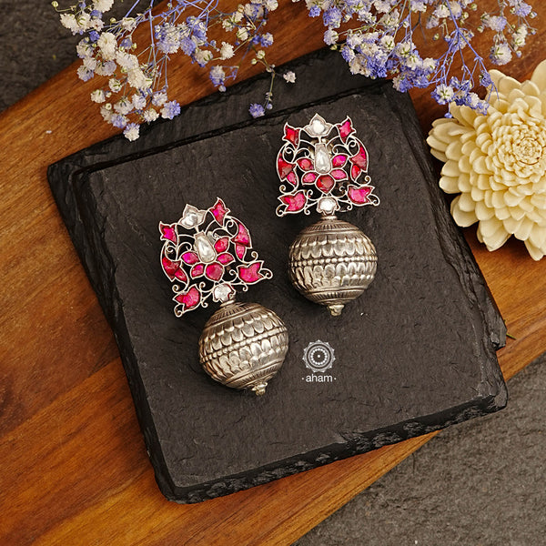 Ira drop earrings with elegant Rani Pink Kundan work. Handcrafted in 92.5 sterling silver. Can be paired with both ethnic and western outfits. 