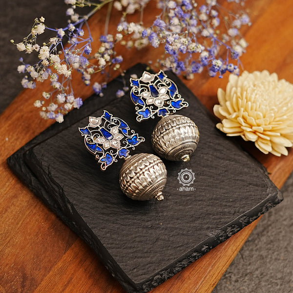Make a statement with these stunning Ira Drop Silver Earrings. Handcrafted in 92.5 sterling silver, the earring is adorned with an elegant blue kundan setting for a sophisticated look. Pairs beautifully with an evening gown. 