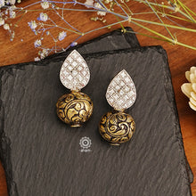 Brighten your looks with these fashionable Ira Drop Silver Earrings; crafted in 92.5 sterling silver, made of dual tones with a chitai ball and kundan top. Perfect for elevating your wardrobe, these earrings add the perfect touch of glitz and glamour.