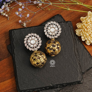 These Ira Kundan Drop Silver Earrings are sure to turn heads. Dual tone, with a Kundan top and dull gold chitai drop, they're a statement piece crafted with 92.5 sterling silver. Show off your style.