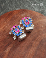 Ira drop earrings with elegant Blue and pink kundan. Handcrafted in 92.5 sterling silver with semi precious stone setting. Can be paired with both ethnic and western outfits.