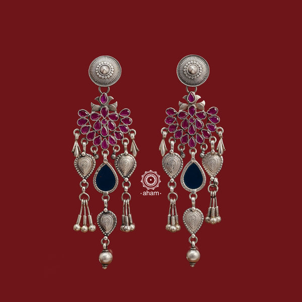 Introducing our Ira Silver Earrings, featuring a stunning deep pink stone and a subtle blue glass highlight handcrafted in 92.5 silver. Our modern design incorporates traditional techniques, resulting in a unique and elegant piece. Elevate your style with these beautiful earrings.