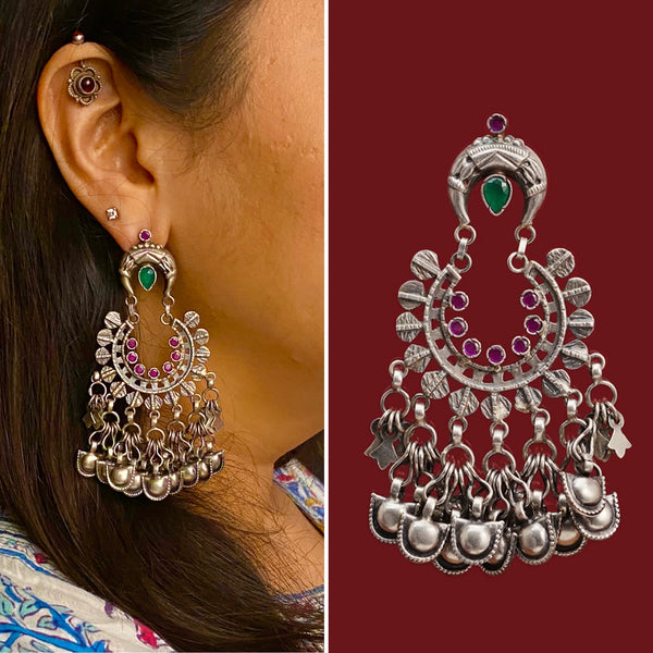Crafted with expertise, the Ira Chandbali Silver Earrings are made of 92.5 sterling silver. They are an ideal accessory for special occasions and festivals, featuring stunning green and pink stones.