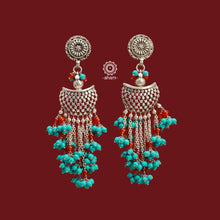 Expertly handcrafted with 92.5 silver, these Ira Turquoise Silver Earrings feature stunning beaded turquoise and delicate coral accents. Make a statement with this unique, fun piece that will elevate any outfit. Perfect for those who appreciate artisanal craftsmanship and bold accessorizing.