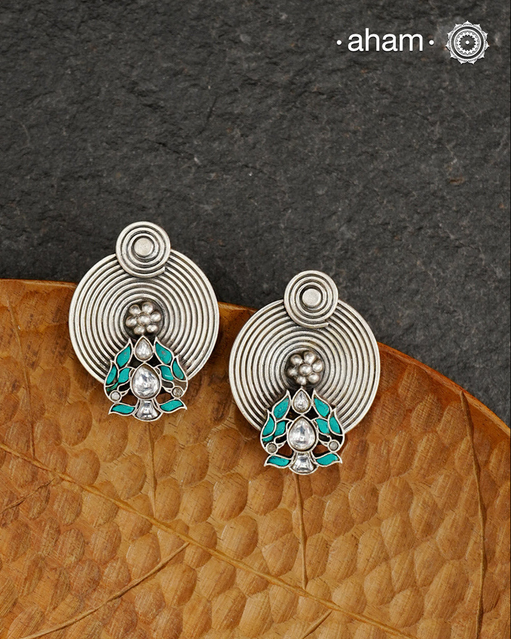 Smart earrings crafted in 92.5 silver with turquoise highlights.