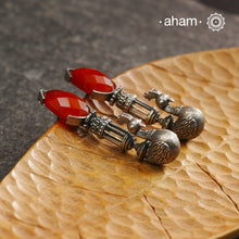 Enhance your style with these Ira Carnelian Peacock Silver Earrings. The stunning peacock design and vibrant carnelian stone create a unique and understated look. Handcrafted in 92.5 silver, these earrings are a perfect addition to any jewellery collection.
