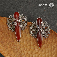 Elevate any look with our Ira Carnelian Stone Silver Earrings. These stunning statement earrings feature a carnelian drop with intricate silver filigree patterns, crafted in 92.5 silver. Perfect for formal events, these earrings add a touch of elegance and sophistication.