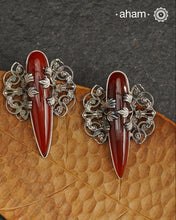 Elevate any look with our Ira Carnelian Stone Silver Earrings. These stunning statement earrings feature a carnelian drop with intricate silver filigree patterns, crafted in 92.5 silver. Perfect for formal events, these earrings add a touch of elegance and sophistication.