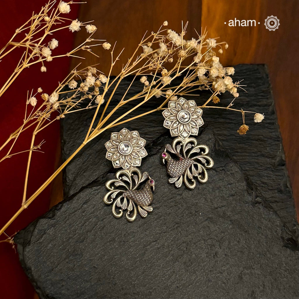 Handcrafted 92.5 sterling silver Ira Earrings with a beautiful kundan flower and peacock. Perfect to add a bit of sparkle to your festive wear. 