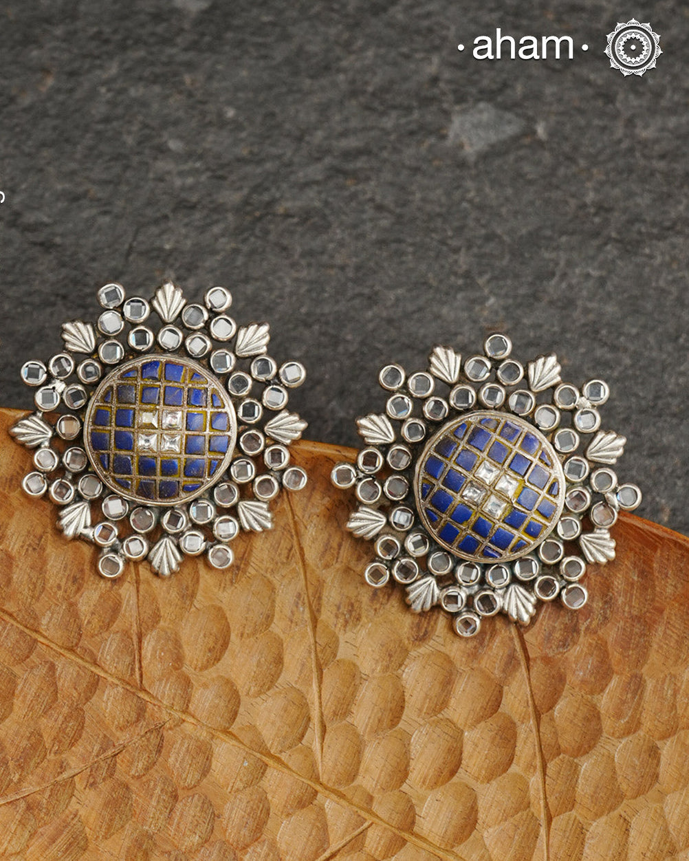Handcrafted 92.5 sterling silver Ira Earrings with lapis chips in the center surrounded by zircon stones. Perfect for special occasions and festivities.