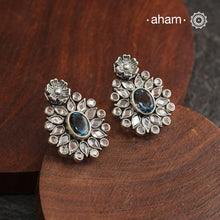 These Ira Silver Earrings add a touch of glamour to any outfit. With a stunning blue center stone and intricate zircon setting, these drop earrings are crafted in 92.5 silver for a luxurious touch. Elevate your style and make a statement with these elegant and timeless earrings.