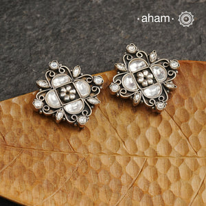 Handcrafted with precision, the Ira Silver Studs are adorned with stunning kundan work. Made from 92.5 silver, these elegant earrings add a touch of sophistication to any outfit. Perfect for special occasions.