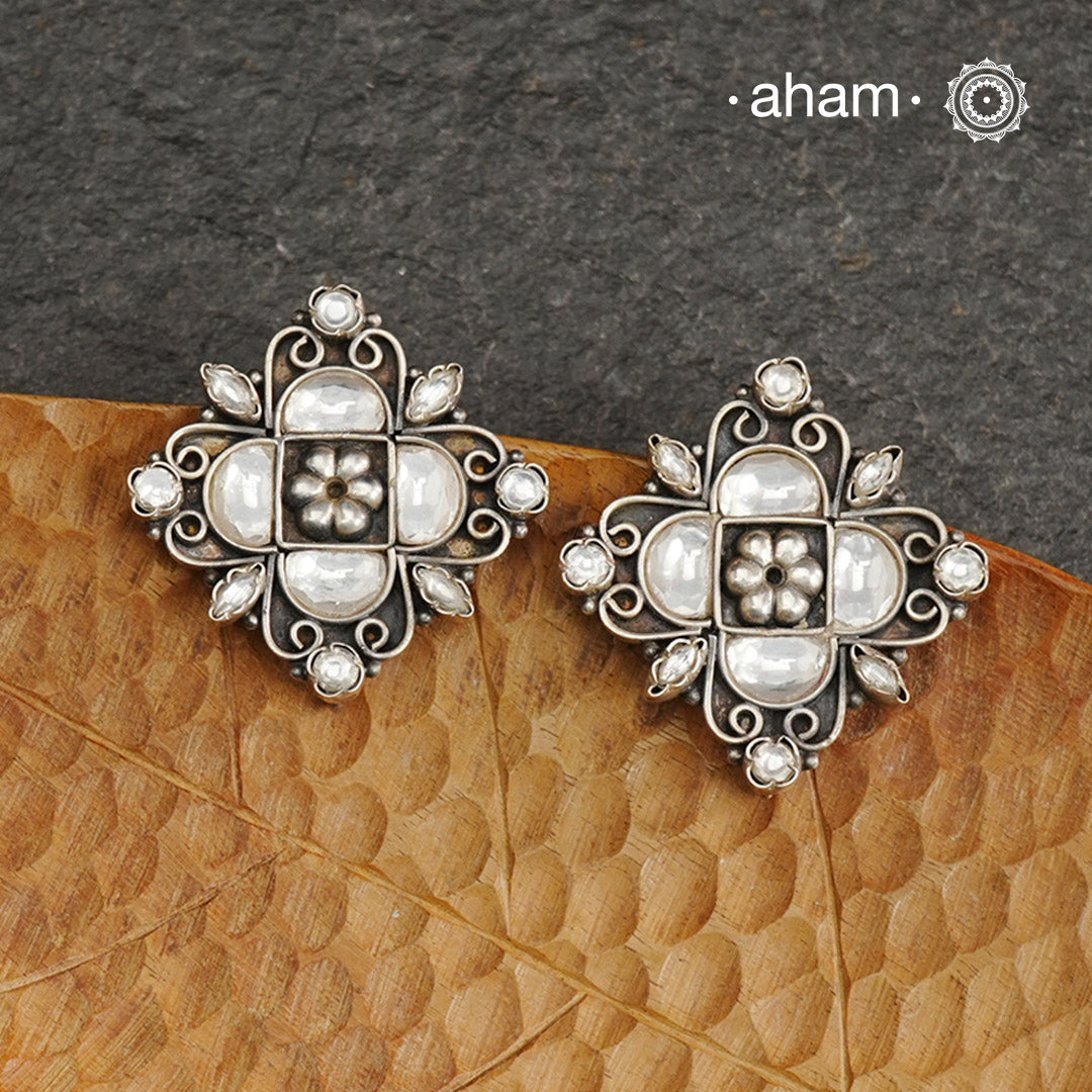 Handcrafted with precision, the Ira Silver Studs are adorned with stunning kundan work. Made from 92.5 silver, these elegant earrings add a touch of sophistication to any outfit. Perfect for special occasions.