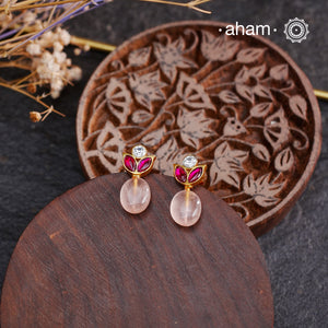 Elevate your style with our Rose Quartz Kundan Gold Polish Silver Earrings. Beautifully crafted with a rose quartz bead adorned with white and pink Kundan gold polish, these earrings are a statement of elegance. Enhance your look with the healing properties of rose quartz, known to promote love and positivity.