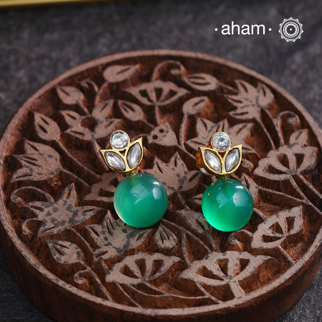 Natural Green Onyx with White Kundan set in 92.5 silver with Gold Polish. Beautiful little earrings that you can wear very often.