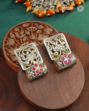 These Ira Silver Earrings add a touch of glamour to any outfit. With a stunning kundan flower highlight, these earrings are crafted in 92.5 silver for a luxurious touch. Elevate your style and make a statement with these elegant and timeless earrings.