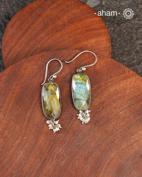 Natural Labradorite stone encased in silver with pearls.