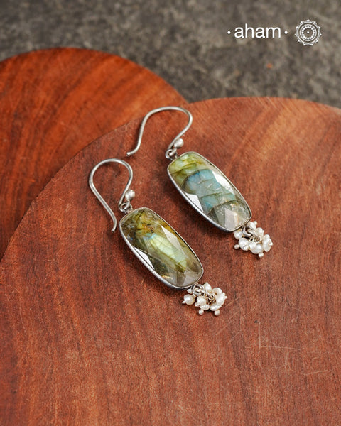 Natural Labradorite stone encased in silver with pearls.