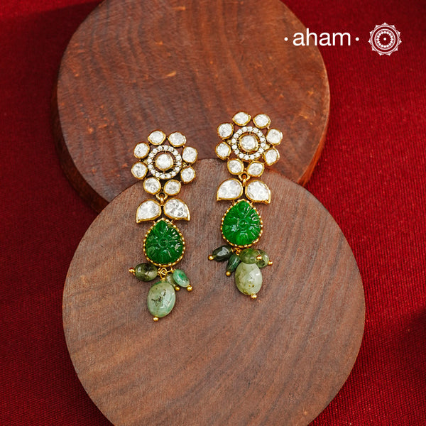 Expertly crafted earrings in 92.5% sterling silver with a refined gold polish finish, elegantly set with brilliant moissanite stones and a green drop. Designed to offer lasting shine and sophistication making them a perfect choice for special occasions.