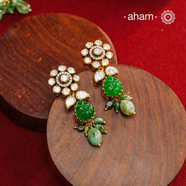 Expertly crafted earrings in 92.5% sterling silver with a refined gold polish finish, elegantly set with brilliant moissanite stones and a green drop. Designed to offer lasting shine and sophistication making them a perfect choice for special occasions.