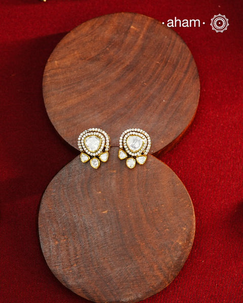 These expertly crafted studs feature 92.5% sterling silver with a fine gold polish finish and elegantly set with brilliant moissanite stones. Designed to offer lasting shine and sophistication making them a perfect choice for both everyday wear and special occasions.