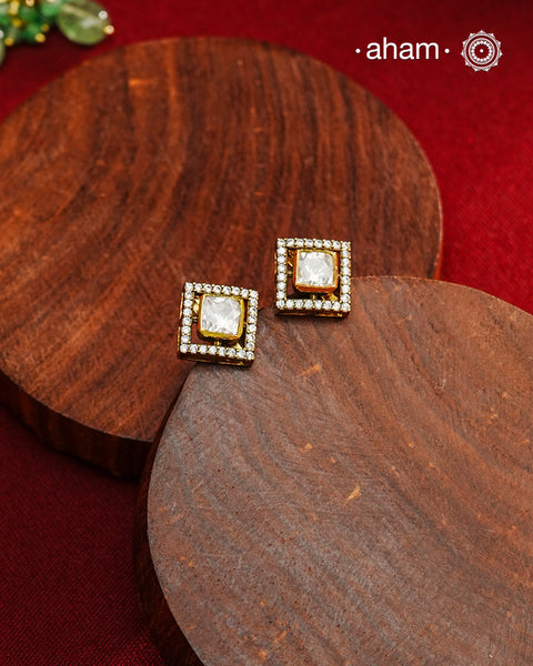 These expertly crafted studs feature 92.5% sterling silver with a refined gold polish finish, elegantly set with brilliant moissanite stones. Designed to offer lasting shine and sophistication making them a perfect choice for both everyday wear and special occasions.