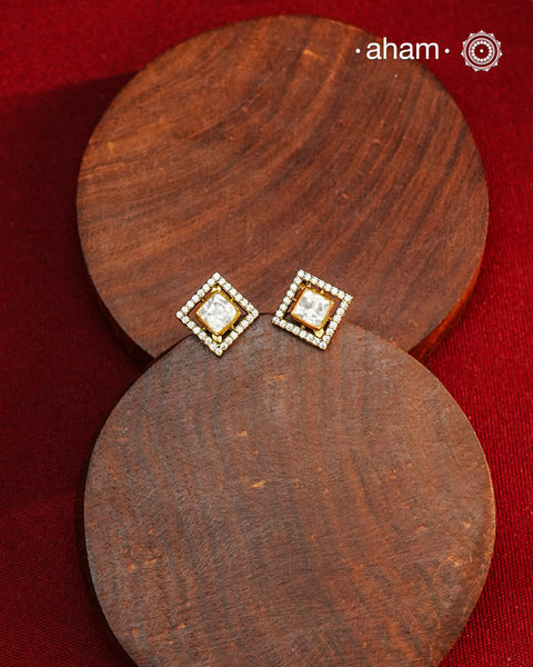 These expertly crafted studs feature 92.5% sterling silver with a refined gold polish finish, elegantly set with brilliant moissanite stones. Designed to offer lasting shine and sophistication making them a perfect choice for both everyday wear and special occasions.