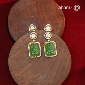 Expertly crafted earrings in 92.5% sterling silver with a refined gold polish finish, elegantly set with brilliant moissanite stones and green drop. Designed to offer lasting shine and sophistication making them a perfect choice for special occasions.