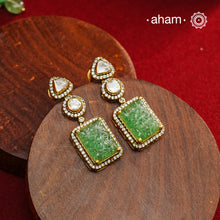 Expertly crafted earrings in 92.5% sterling silver with a refined gold polish finish, elegantly set with brilliant moissanite stones and green drop. Designed to offer lasting shine and sophistication making them a perfect choice for special occasions.