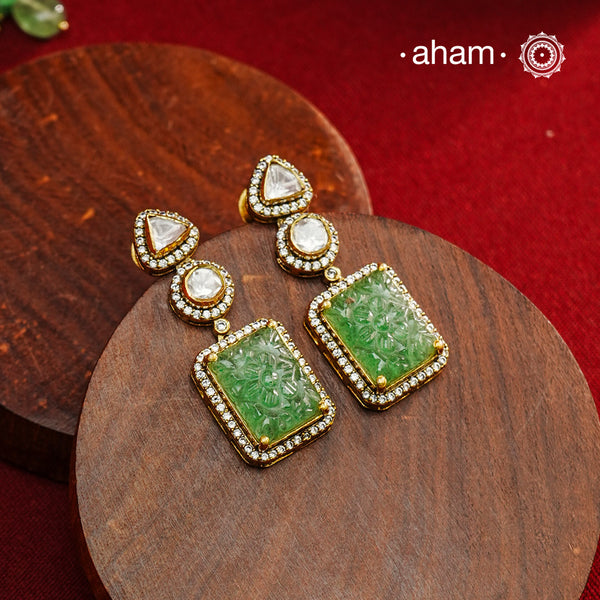 Expertly crafted earrings in 92.5% sterling silver with a refined gold polish finish, elegantly set with brilliant moissanite stones and green drop. Designed to offer lasting shine and sophistication making them a perfect choice for special occasions.