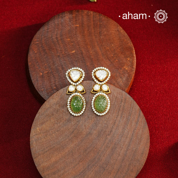 Expertly crafted earrings in 92.5% sterling silver with a refined gold polish finish, elegantly set with brilliant moissanite stones and green drop. Designed to offer lasting shine and sophistication making them a perfect choice for special occasions.